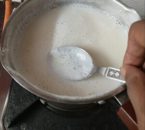 scoop out the foam at the top of the soy milk as its being boiled