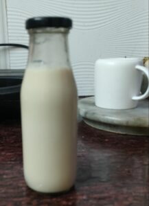 homemade soy milk in a glass bottle